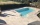 Terrasse de piscine en pierre beige pour aménagement extérieur